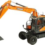DOOSAN DX160W Pelle sur pneus avec 2 accessoires